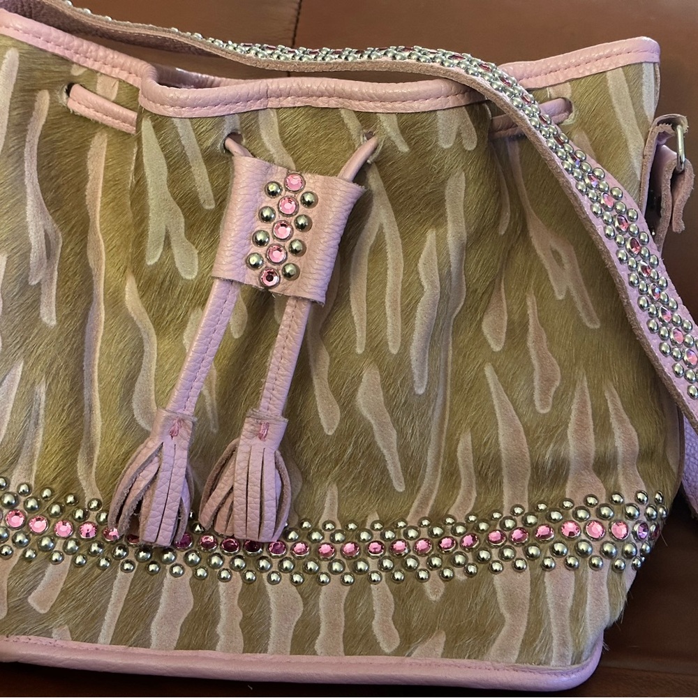 Pink Raviani cowhide draw string bag w/ pink crystals